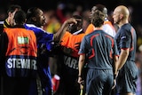 Drogba argues with the referee