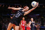 Physical encounter ... New Zealand's Bailey Mes is challenged by England's Geva Mentor