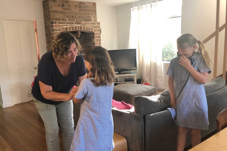 Germana Eckert talks to daughter Eve while Stefanie looks on.