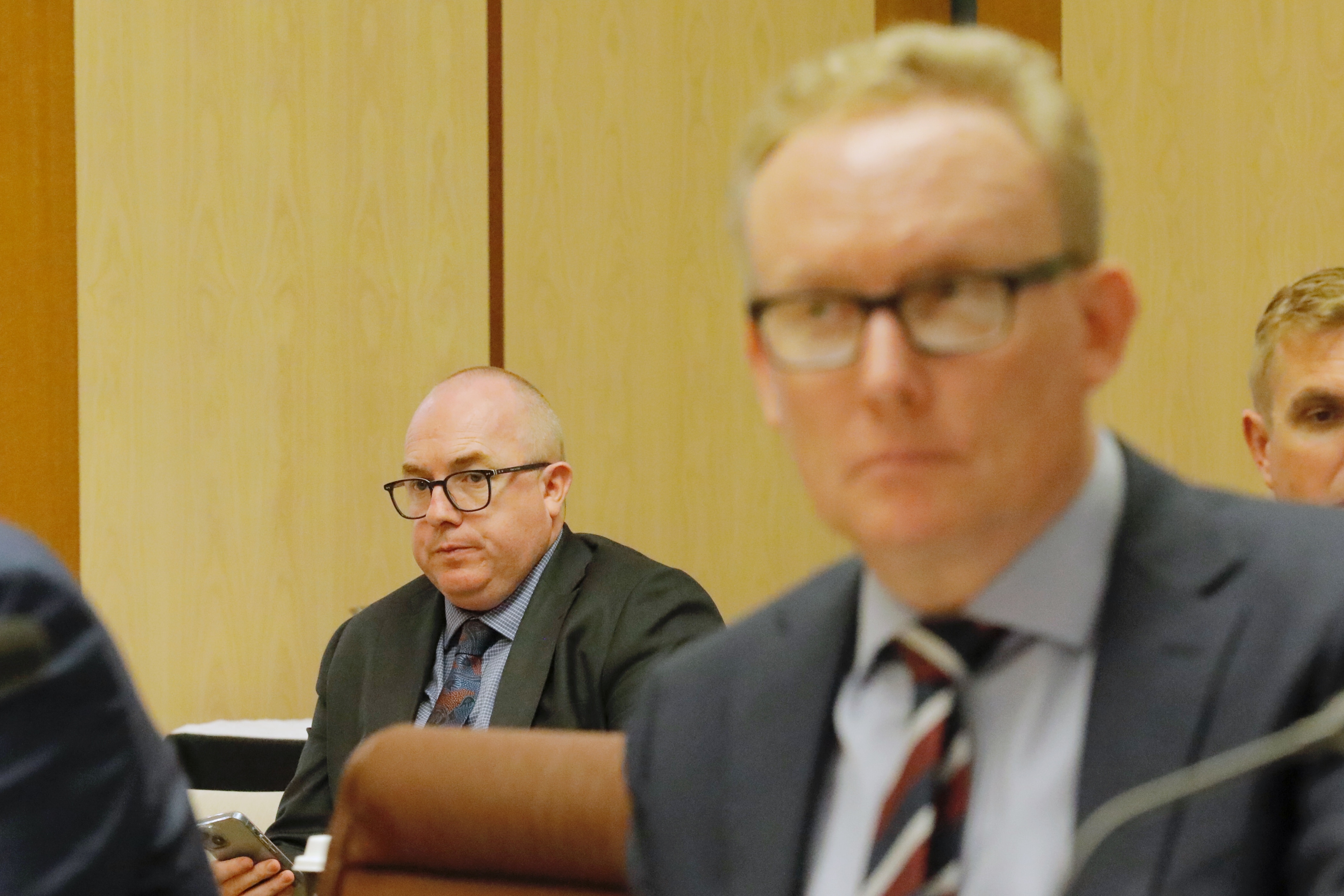 Jarrod Howard and David Hazlehurst during senate estimates.