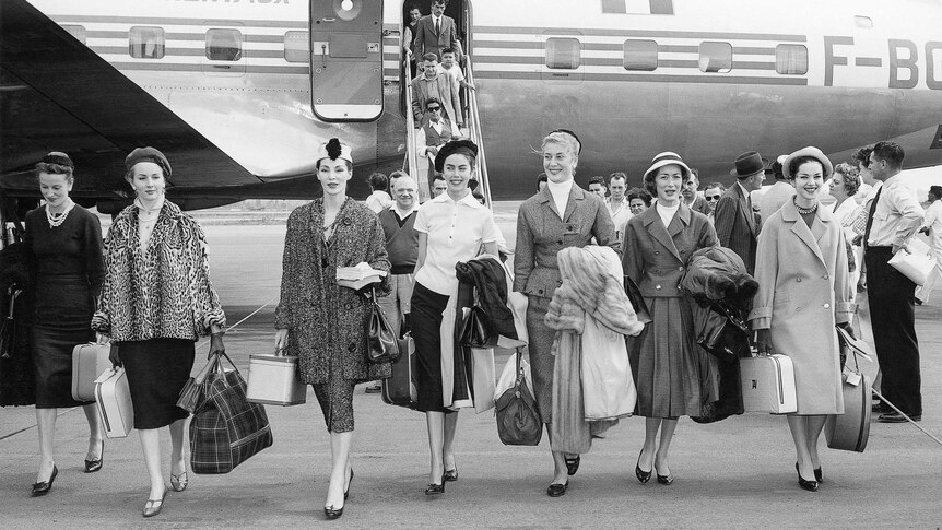 Models arriving in Australia for the presentation of Christian Dior's last collection in 1957.