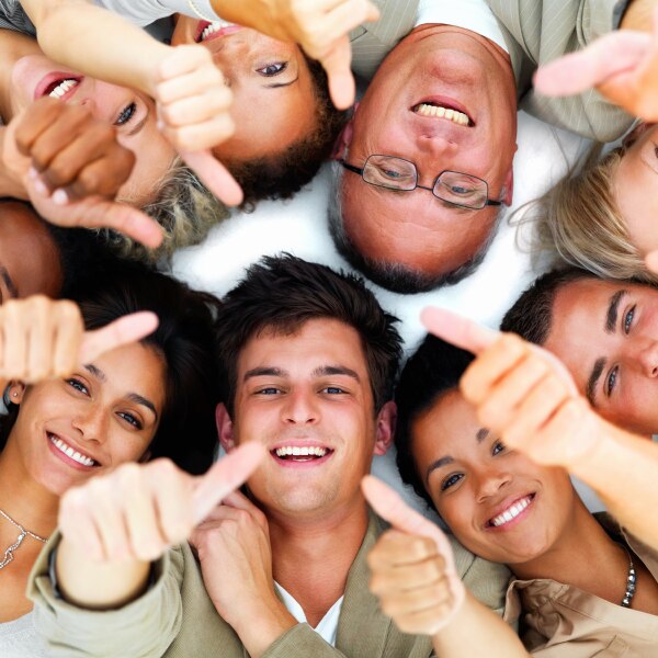 A group of people with thumbs up