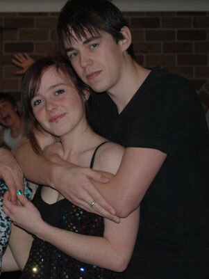 Photo of an 18 year old Rachele and a Nick at a party posing and smiling for the camera.