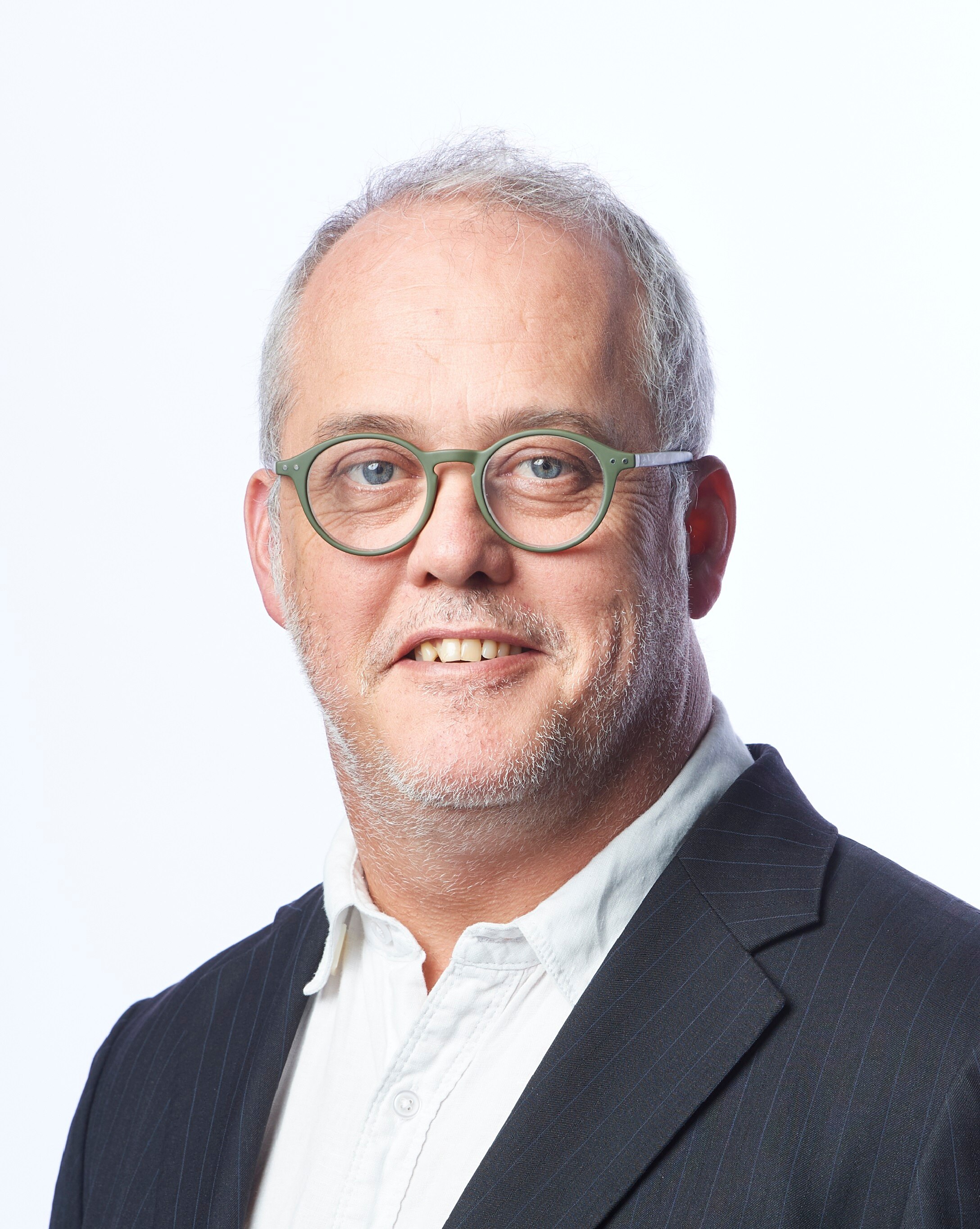 A photographic portrait of a man wearing glasses.