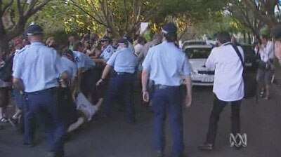 Police scuffled with protesters outside a function marking 10 years of the Howard Government.