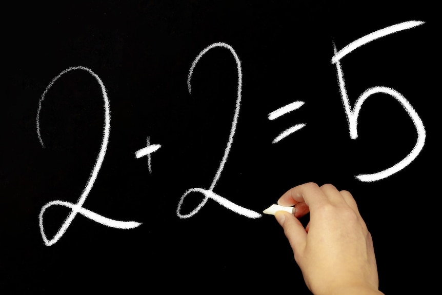 A blackboard with the equation '2 + 2 = 5'