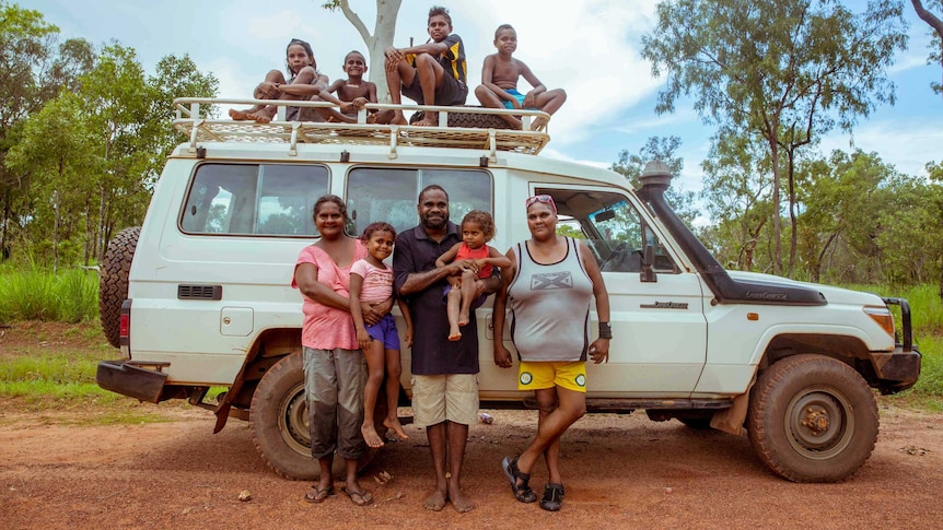 The Dirdi family in front of 4WD