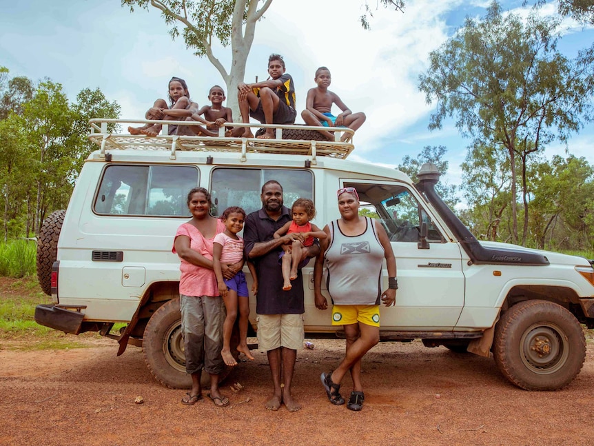 The Dirdi family in front of 4WD