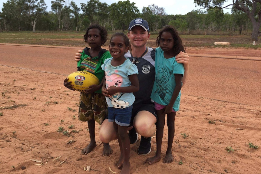 AFL Player Patrick Dangerfield with children on Groote Eylandt