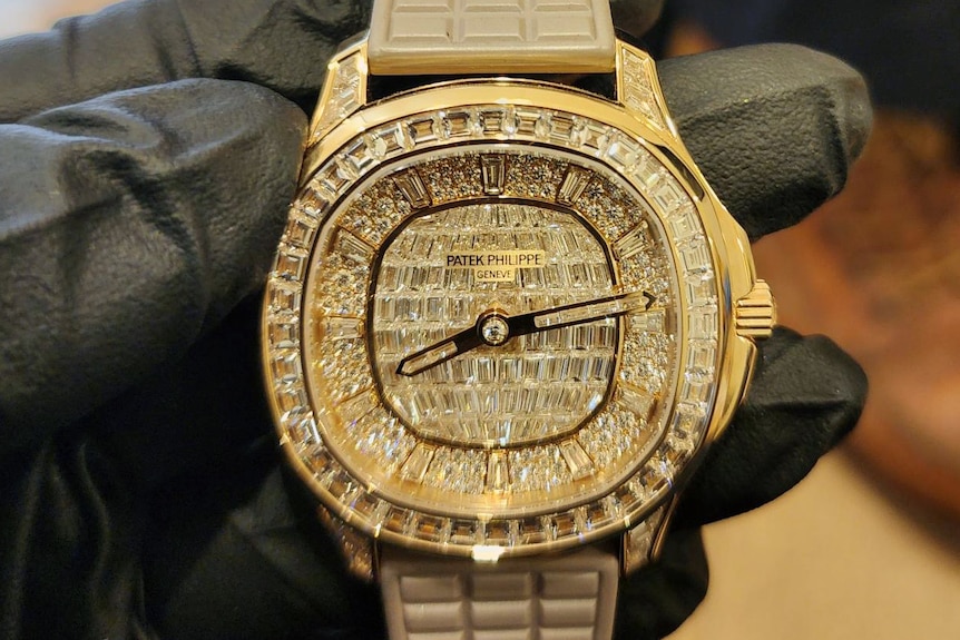 A glittering watch made of gold and jewels