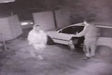 Two men and a white car