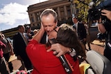 A woman kisses Bill Shorten in Adelaide