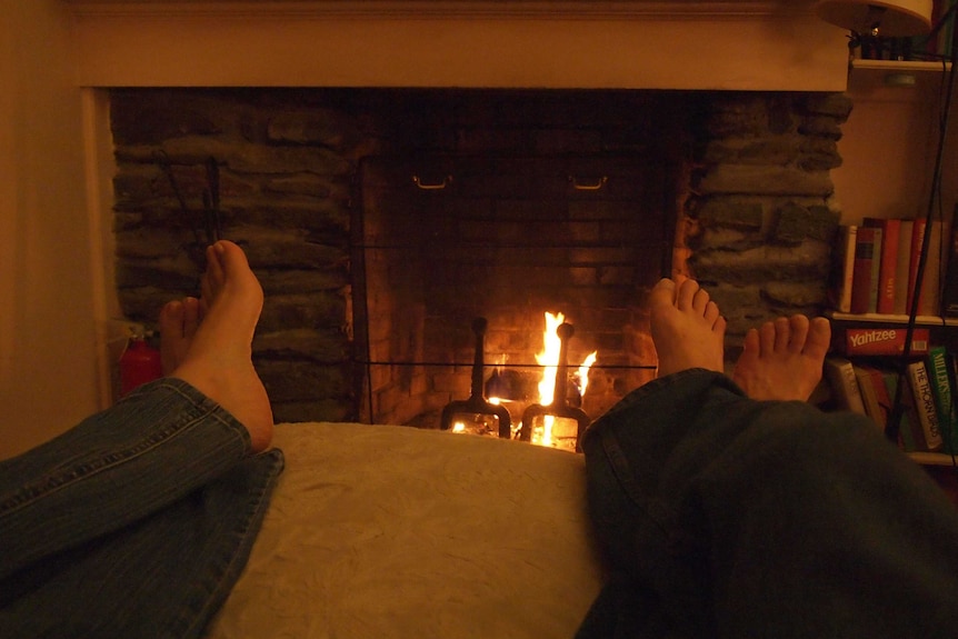 Feet in front of a fire