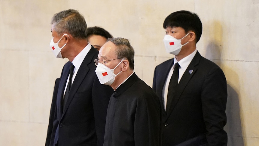 Chinese delegation views Queen Elizabeth's coffin from a balcony in Westminster.