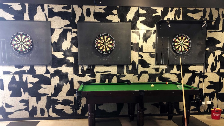 A pool table and three dart boards at the Howard Springs facility