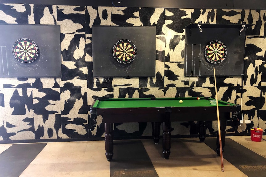 A pool table and three dart boards at the Howard Springs facility