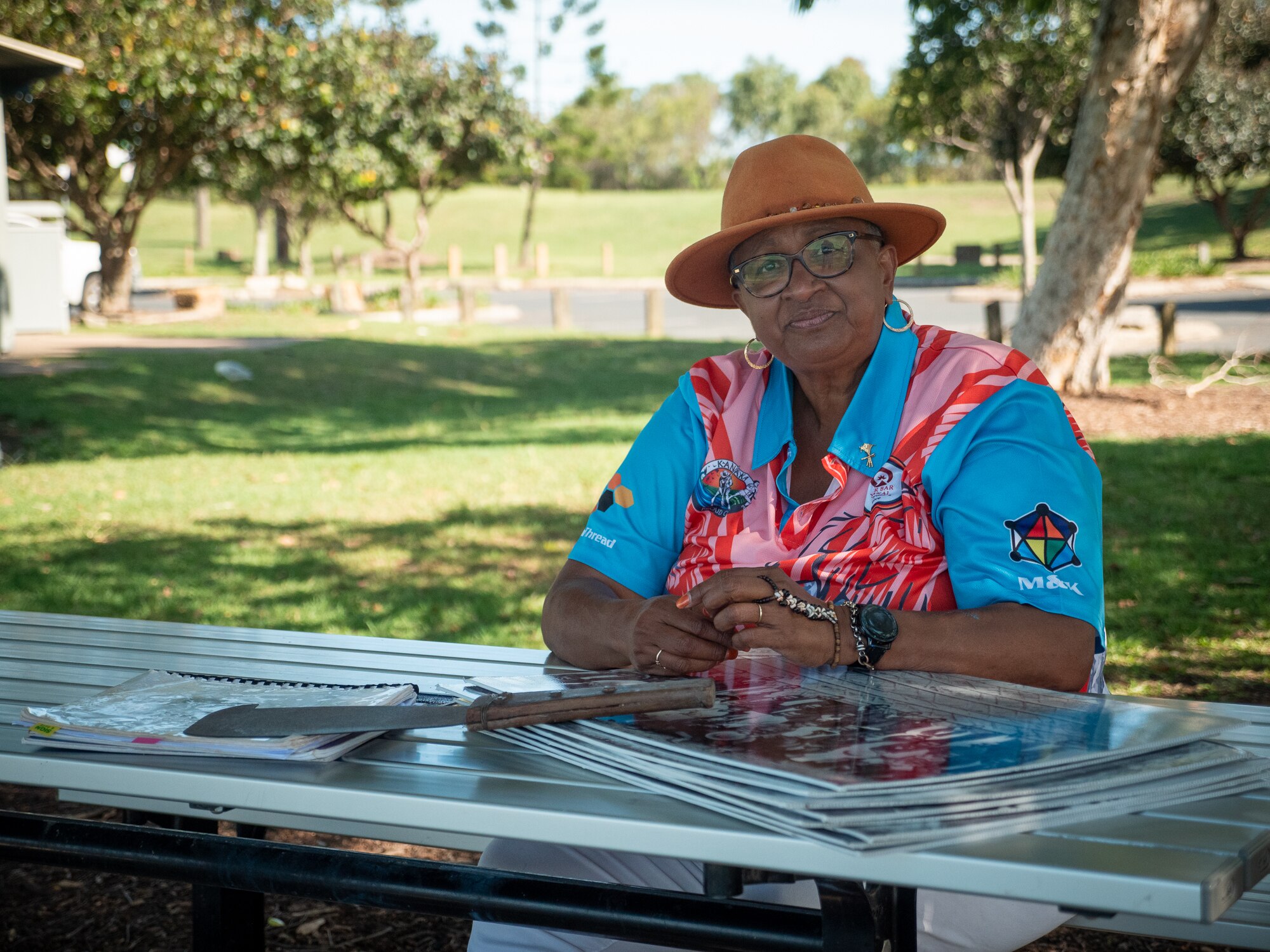 Marion Healy sits at picnic table in Mackay, November 2021.