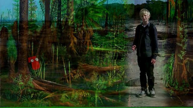 Boy stands at beach, image of ancient forest overlaid