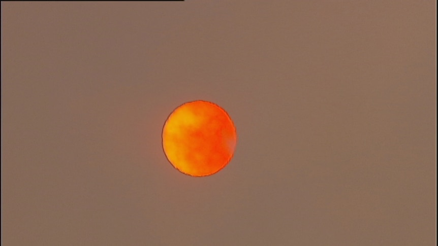 orange sun in sky near epping, victoria