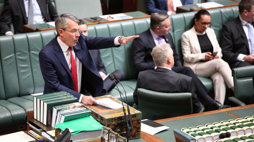 Mr Dreyfus is gesturing across the despatch box at the government benches.