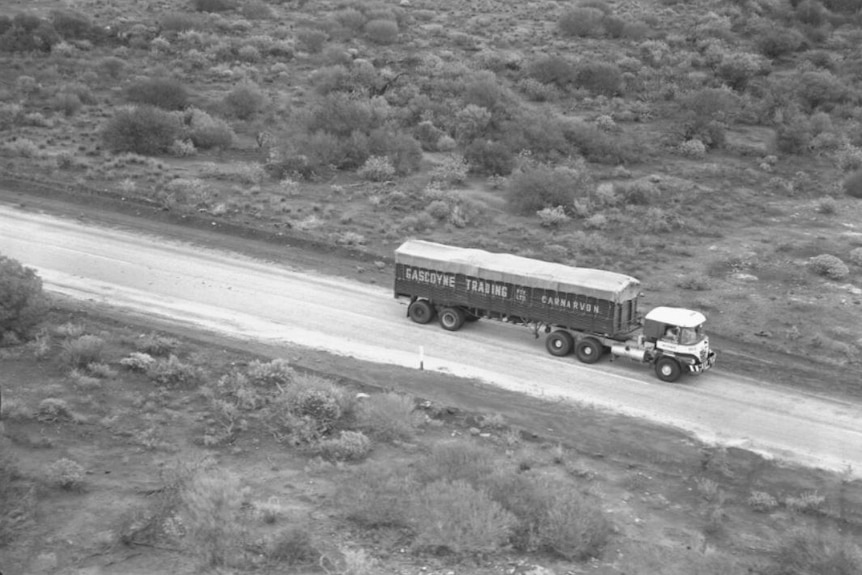 A black and white photo of truck
