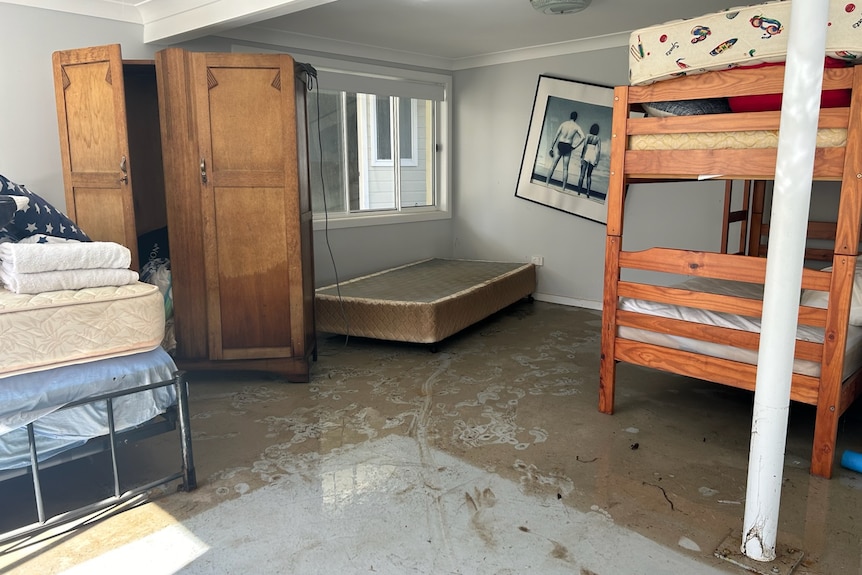 Wooden furniture wet on muddy concrete floor