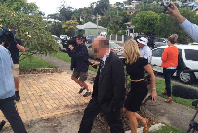 The director of child safety at Education Queensland, Brett Anthony O'Connor (centre), arrives at Tweed Heads local court.