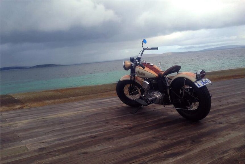 A 1942 Indian 741 Military Scout motorbike on the boardwalk at Bremer Bay on an overcast day