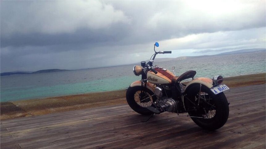 A 1942 Indian 741 Military Scout motorbike on the boardwalk at Bremer Bay on an overcast day