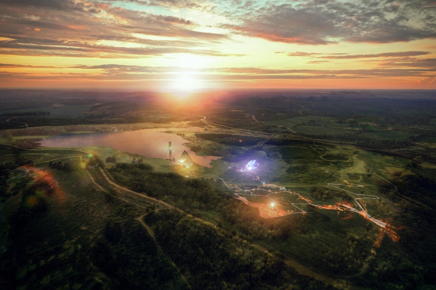 An artist's impression from an aerial view of the Eden Project's plan showing a large lake at sunset.