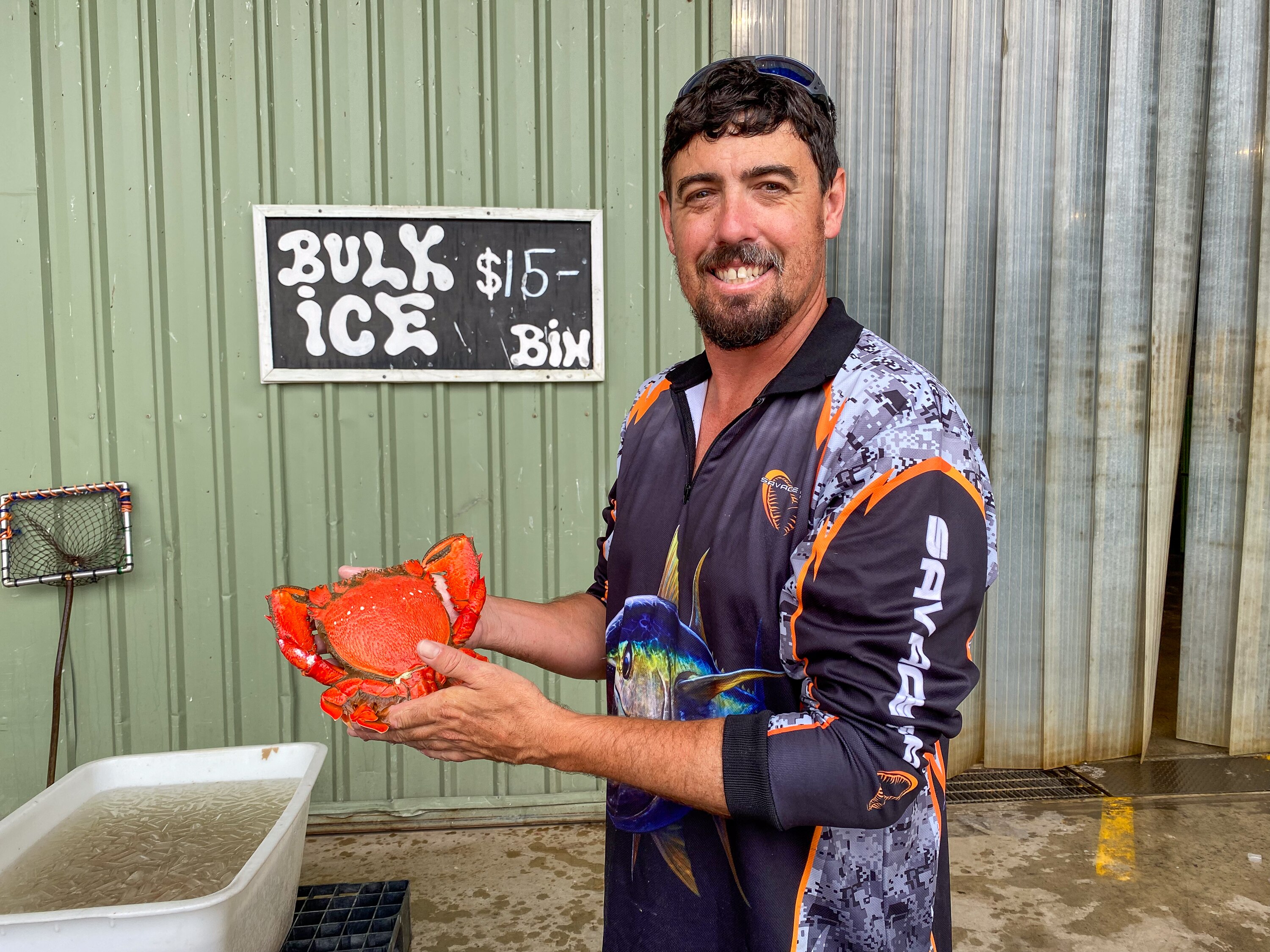 a man holding a crab