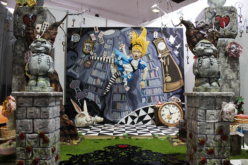 A life-size sugar sculpture depicting characters from Alice in Wonderland.
