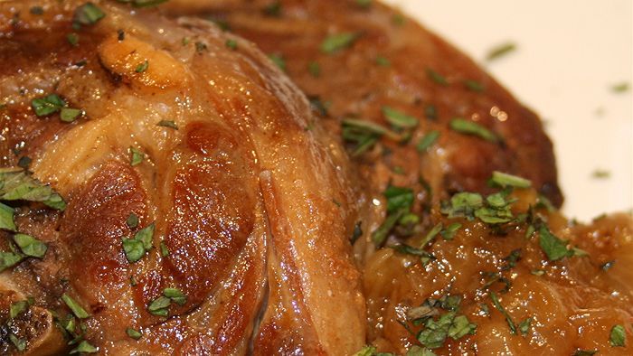 Slow cooked lamb and onion in a pot - ABC News