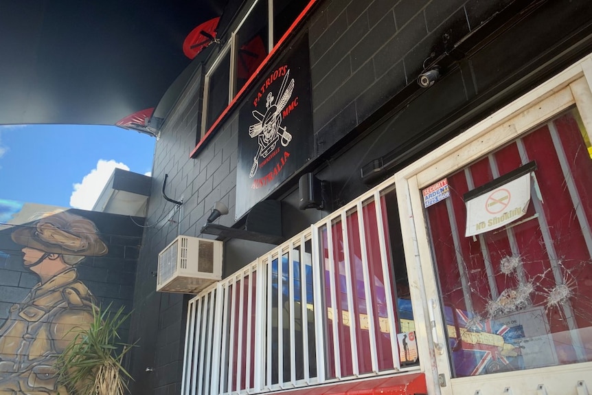 The front of the Patriots Military Motorcycle Club Townsville chapter, with shattered glass on the front window.