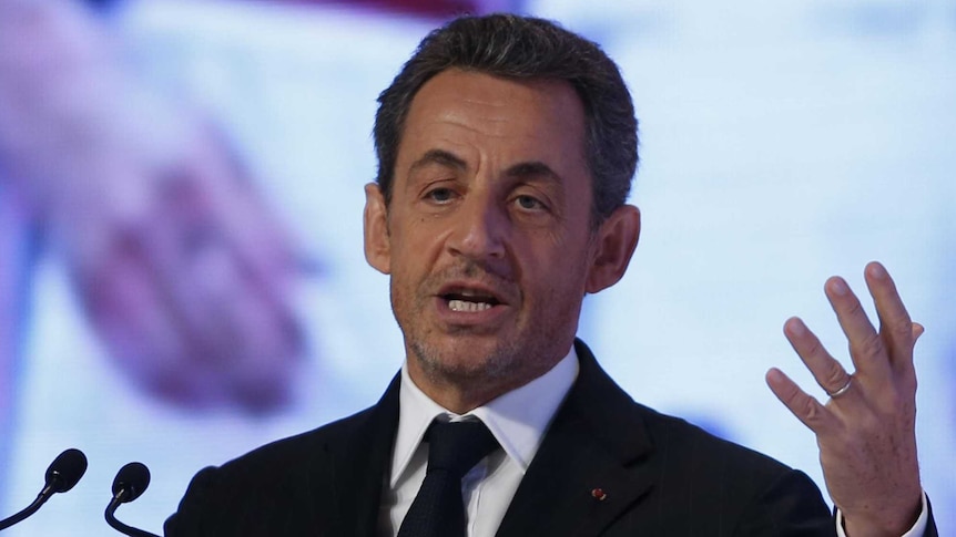 Former French president Nicolas Sarkozy speaking in Doha