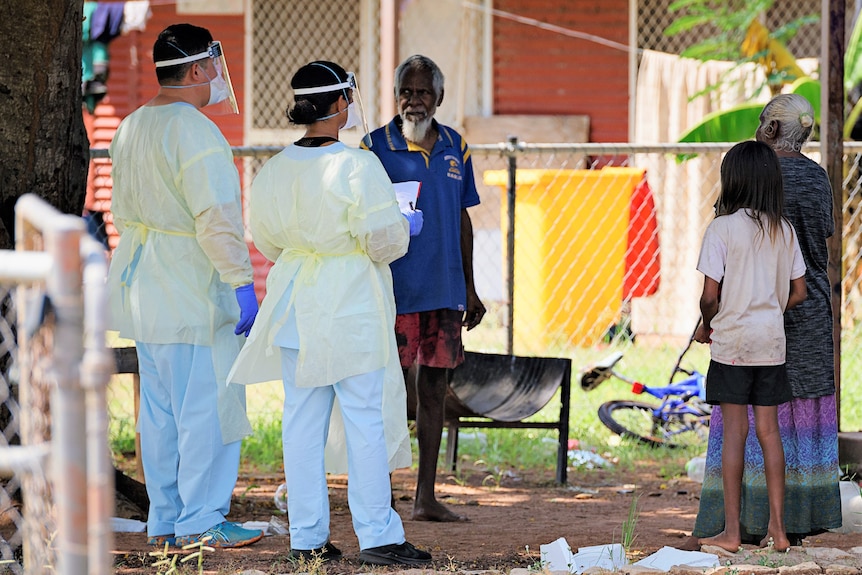 health workers administering vaccines