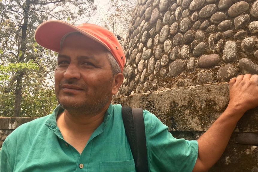 Dehradun-based journalist Raju Gusain in front of a meditation hut