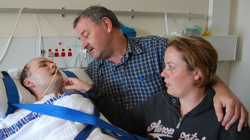 Tom Keohane (centre) talks to his son David Keohane in hospital in 2008
