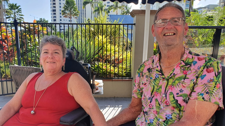 Couple Robin and Clyde in their wheelchairs at their resort in Cairns