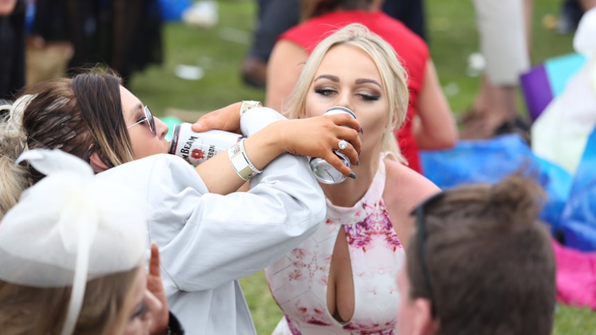Racegoers enjoy the party at the 2016 Melbourne Cup.