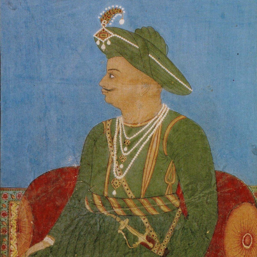 A painting of Tipu Sultan who looks to the side while seated. His clothes are green.