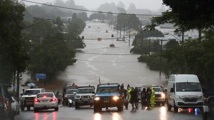 Boats rescue people on flooded roads in Lismore