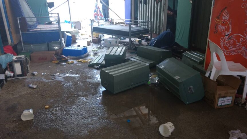 Tipped over containers and rubbish on the ground at the Manus Island detention centre.