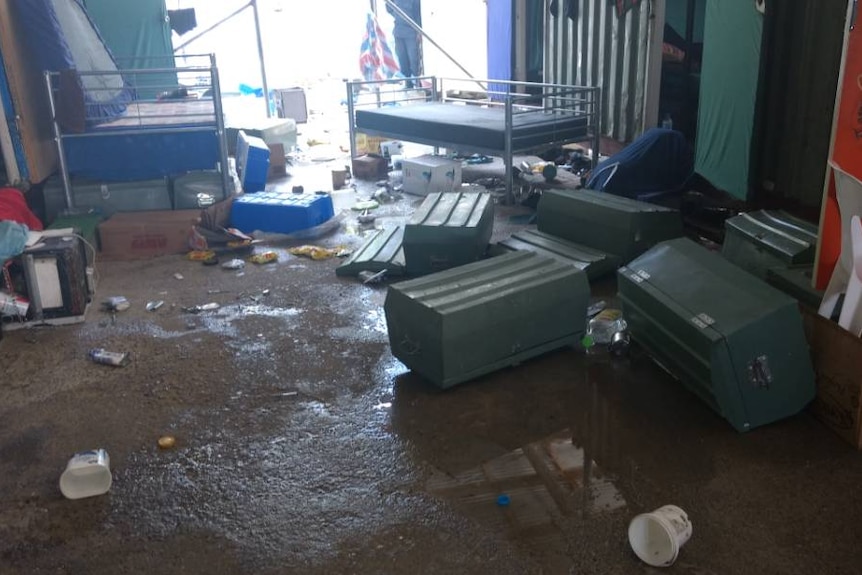 Tipped over containers and rubbish on the ground at the Manus Island detention centre.