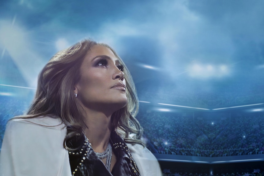 A photo of Jennifer looking out at a stadium.