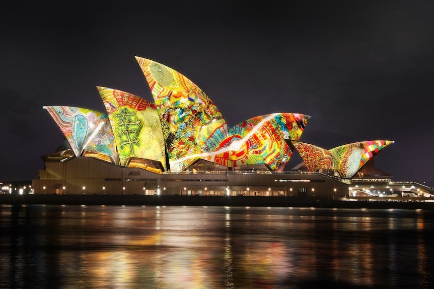 The Sydney Opera House sails lit up with artwork from the Yarrkalpa - Hunting Ground digital artwork