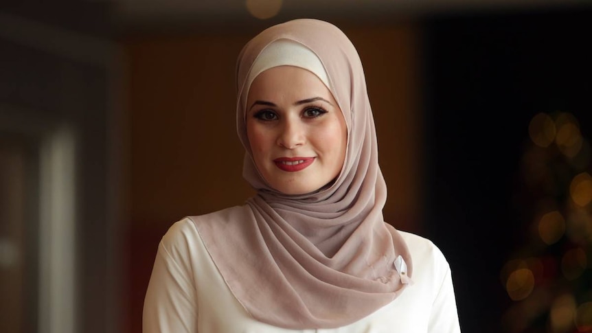 Woman wearing a pink and white hijab 