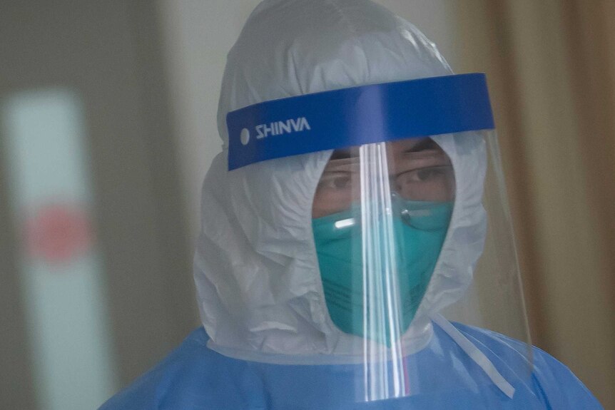 A medical staff member wearing protective a suit works in the department of infectious diseases at Wuhan Union Hospital.