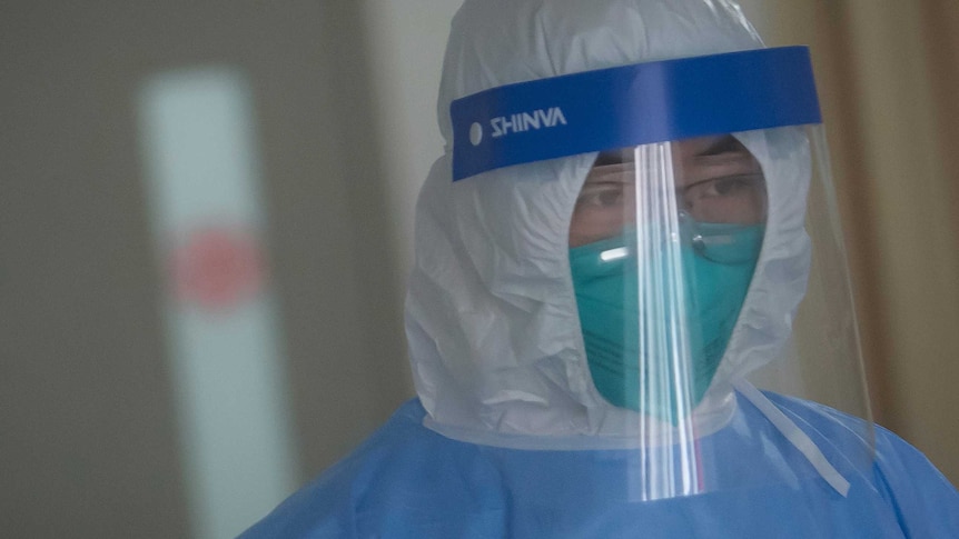 A medical staff member wearing protective a suit works in the department of infectious diseases at Wuhan Union Hospital.