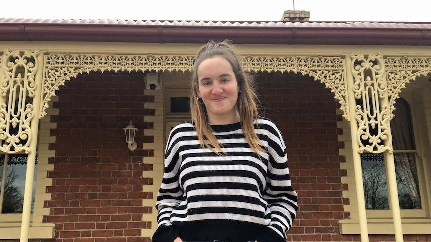 Singer Gabbi Bolt stands outside her home in Bathurst with hands in pocket.